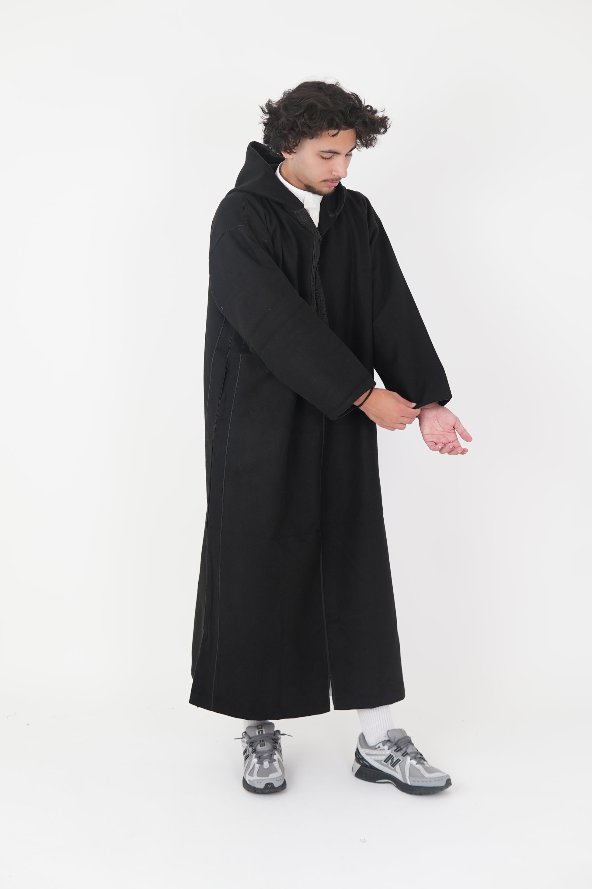 Man wearing a Black Moroccan Djellaba – traditional hooded thobe robe