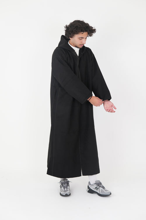 Man wearing a Black Moroccan Djellaba – traditional hooded thobe robe