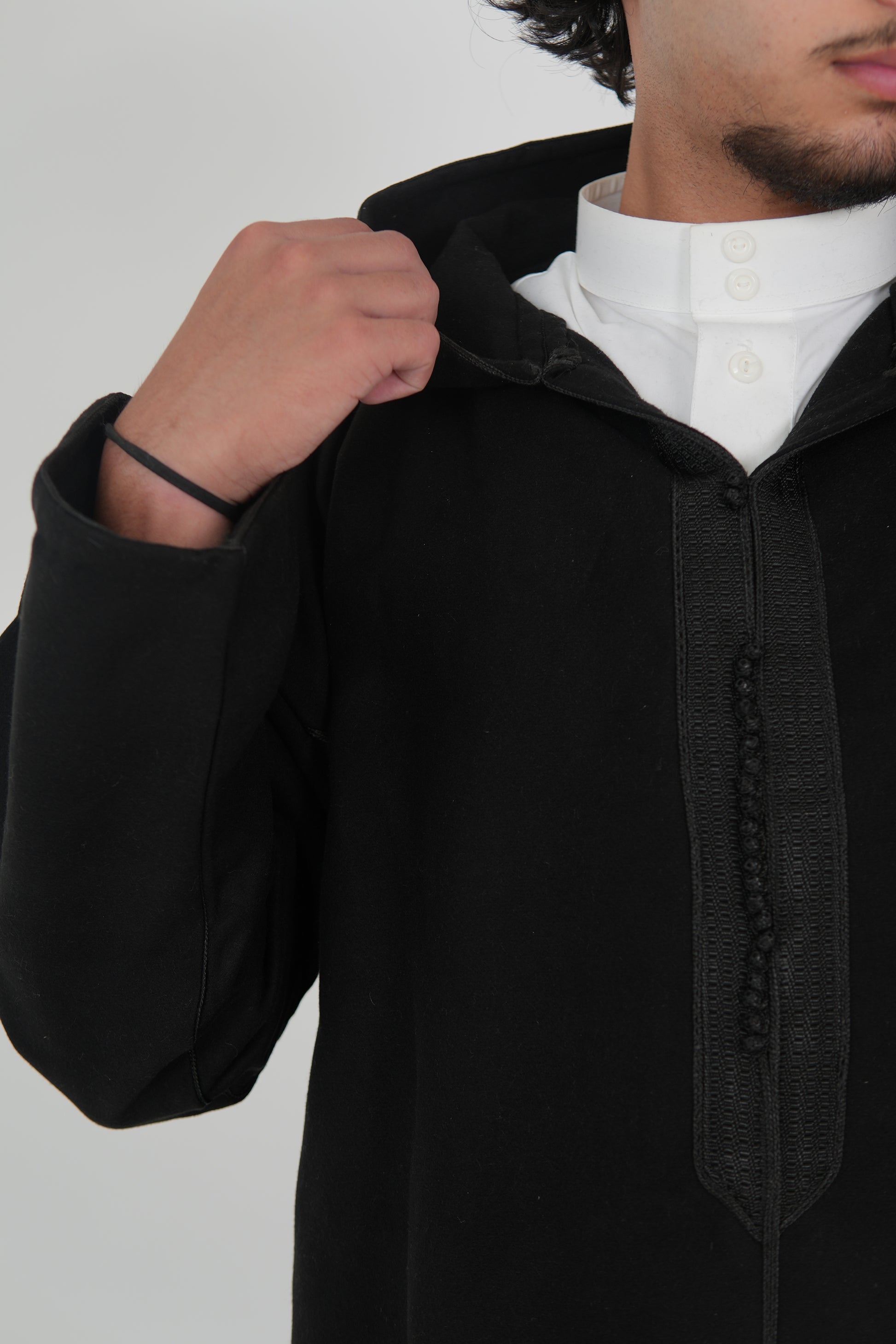 Man wearing a Black Moroccan Djellaba – traditional hooded thobe robe
