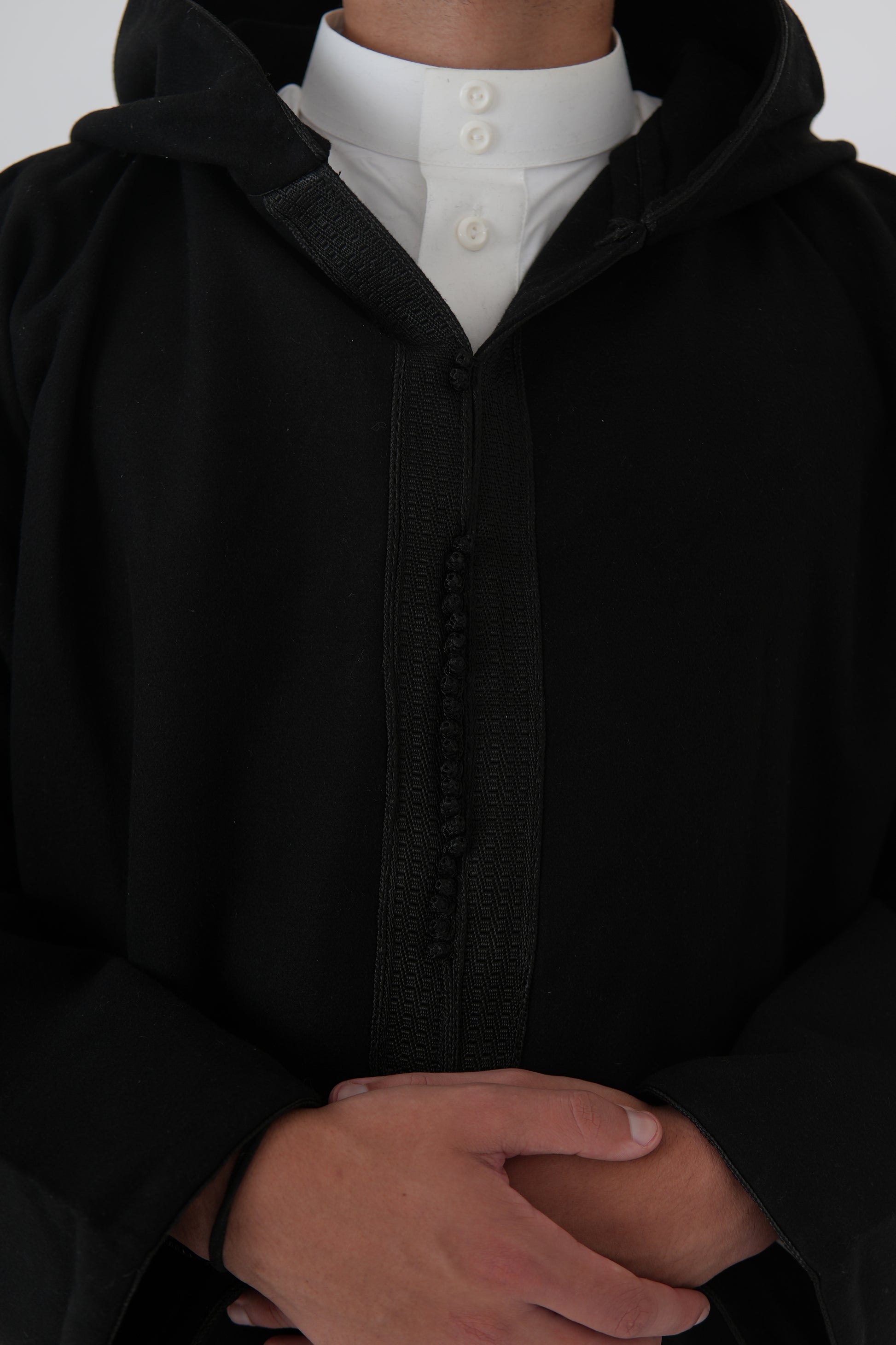 Man wearing a Black Moroccan Djellaba – traditional hooded thobe robe